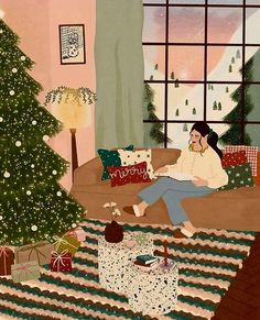 a woman sitting on the steps in front of a christmas tree