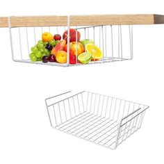 a white wire basket hanging from a wooden shelf next to a plastic fruit tray with handles