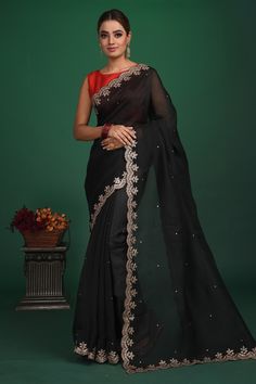 Shop beautiful black embroidered organza saree online in USA with designer blouse. Be a vision of style and elegance at parties and special occasions in beautiful designer sarees, embroidered sarees, printed sarees, satin saris from Pure Elegance Indian fashion store in USA.-full view Bollywood Style Black Cotton Silk Pre-draped Saree, Black Cotton Silk Pre-draped Saree For Diwali, Black Tissue Silk Traditional Wear For Wedding, Black Tissue Silk Traditional Wedding Wear, Embroidered Silk Saree For Party Wear, Black Silk Embroidered Saree, Silk Embroidered Party Wear Saree, Black Embroidered Silk Saree, Black Art Silk Traditional Wear With Sheer Dupatta