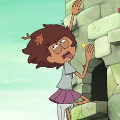 a cartoon girl reaching for an apple in front of a stone wall with her hands up