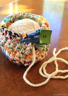 a close up of a yarn ball on a table with a string attached to it