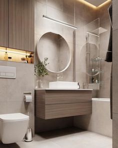 a bathroom with a toilet, sink and shower in it's center wall area