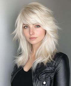 A sleek platinum blonde shag with a side-swept fringe offers a polished and refined take on this trendy style. The smooth texture adds a touch of sophistication, making it perfect for both casual and formal occasions. Bangs Grunge, Burgundy Blonde Hair, Swept Fringe