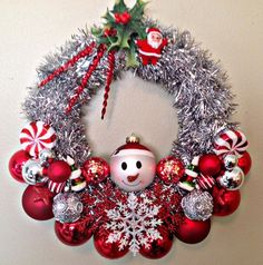 a christmas wreath with a snowman on it