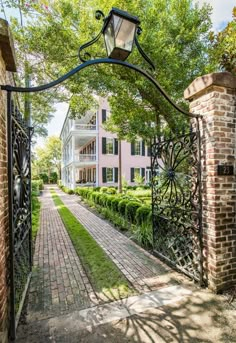 an iron gate leads to the front yard