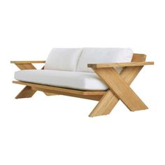 a wooden couch with white cushions on it's back legs and armrests