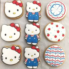 hello kitty cookies are arranged on a sheet of paper