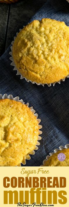 three cornbread muffins sitting on top of a blue cloth