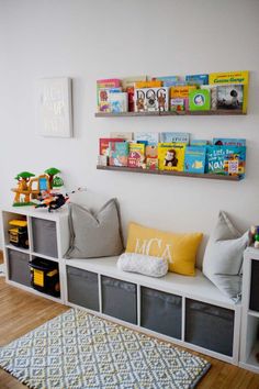 the bookshelves are filled with children's books