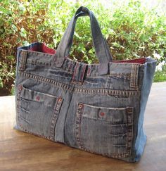 a bag made out of jeans sitting on top of a wooden table