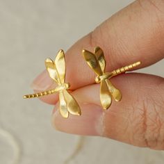 "Our specially handcrafted dragonfly stud earrings are suitable for nature lovers. It is always fun to accessorize your outfit with a great pair of earrings. Even a regular T-shirt and a pair of jeans can be transformed when put together with the right pair of jewelry. Earrings are a subtle expression of the style you subscribe to, they tell stories about your interests, hobbies, and even your favorite things in life. Easily purchase a pair for your different outfits. SHIPPING Your order will sh Gold Dragonfly Earrings For Gift, Dragonfly-shaped Pierced Earrings As Gift, Gold Nickel-free Dragonfly Earrings, Nickel-free Gold Dragonfly Earrings, Hypoallergenic Dragonfly Earrings As A Gift, Hypoallergenic Dragonfly Earrings For Gift, Tat Rings, Chihuahua Art, Dragonfly Gifts