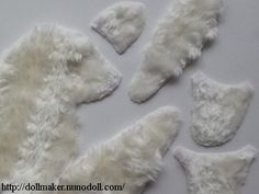 several pieces of white fur laid out on top of each other in the shape of polar bears