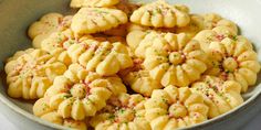 a bowl full of cookies with sprinkles on top, ready to be eaten