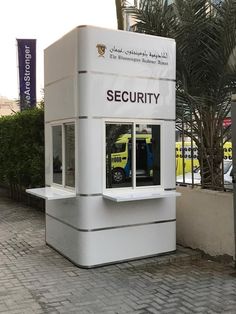 a security booth sitting on the side of a road