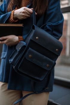 Model INGI Dark Blue Crazy Horse Leather Women's Backpack: Small Daily Pack and City Rucksack Elevate your style with our Dark Blue Crazy Horse Leather Women's Backpack. Crafted from premium Crazy Horse leather, this backpack boasts a vintage finish that gets better with time. It's designed to be your ideal companion for city adventures, daily commutes, and casual outings. Features: * Premium Leather: Made from high-quality dark blue Crazy Horse leather, ensuring durability and a unique, vintage look. * Compact Size: Perfect for daily use with dimensions of 20 x 25 x 12 cm, offering ample space without being bulky. * Multiple Compartments: Organized storage with several pockets to keep your essentials neatly arranged. * Comfortable Carry: Adjustable straps provide a comfortable fit for all Blue Rectangular Leather Backpack, Large Capacity Blue Satchel Backpack, Adjustable Strap Leather Backpack For Students, Blue Leather Backpack For Everyday Use, Blue Leather Satchel Backpack, Blue Student Satchel With Adjustable Strap, Blue Satchel Backpack For Everyday Use, Blue Satchel Backpack, Everyday Blue Satchel Backpack