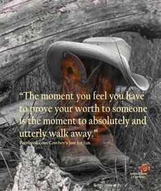 a cowboy's boot sitting in the grass with a quote on it that reads, the moment you feel you have to prove your worth