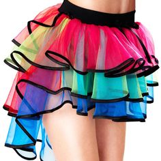 a woman wearing a multi colored skirt with her back turned to the camera and showing off her large breast