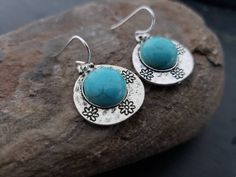 Blue Turquoise Cabochon Silver Teardrop Earrings, Flower Disc Earrings, Tribal Bohemian, Southwestern, Rustic Antique Silver, Gift For Her These earrings feature antique silver plated flower disc charms with howlite turquoise cabochon accent. They have rustic geometric design on the back. They measure 3/4 inch across.