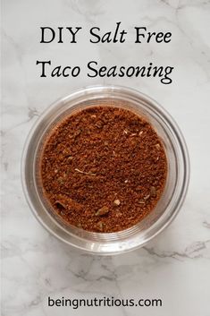 a bowl filled with taco seasoning sitting on top of a counter next to the words diy salt free taco seasoning