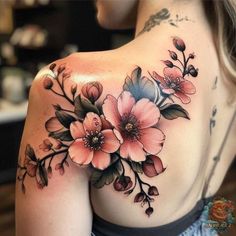 a woman's shoulder with flowers on it