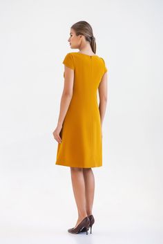 "A midi mustard dress featuring a line silhouette, draped bodice and cap sleeves. - draped bodice - a line silhouette - cap sleeves - scoop neck - knee length (midi) - two pockets in side seams - premium italian fabric Color: yellow (mustard) Fiber: viscose - 60%, elastan - 5%, polyester - 35% Concealed back zipper closure For Size S (6 US): dress length - 39\" (101,5 cm) Our model wears size S (US 6) and is 171 cm/5'6\" tall. You may feel free choosing the size. Just send us your measurements ( Knee-length Pleated Bodice Midi Dress, Yellow Elegant Dress With Pleated Bodice, Knee-length Solid Color Midi Dress With Pleated Bodice, Solid Color Knee-length Midi Dress With Pleated Bodice, Elegant Yellow Dress For Work, Yellow Sheath Midi Dress For Work, Gold Fitted A-line Midi Dress, Elegant Yellow Short Sleeve Midi Dress, Yellow Short Sleeve Midi Dress For Evening