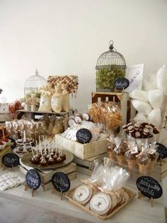 a table topped with lots of desserts and candies