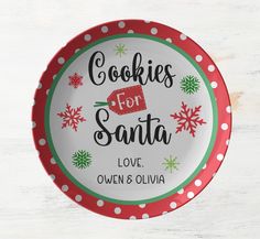 a plate that says cookies for santa love ovens olvia on the front and back