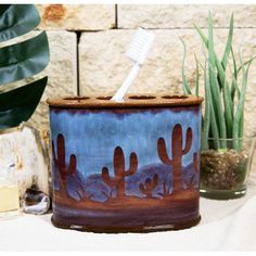 This Southwestern Desert Cactus Design Bathroom Accessory Piece measures 4.25" High, 5.25" Wide and 2.5"Deep approximately. It weighs about 10 ounces.  This Southwestern Desert Cactus Design Bathroom Accessory Piece is made of fine designer polyresin, hand crafted and painted individually.  Western decor is all about spunk and spirit, bringing together the desert beauty of the southwest with rugged cowboy charm and rustic good looks.  With the theme of Arizona's Beautiful Desert Wilderness, this Cactus Bathroom Decor, Cactus Bathroom, Rugged Cowboy, Cactus Arizona, Desert Beauty, Toothbrush And Toothpaste Holder, Beautiful Desert, Bathroom Accents, Toothpaste Holder