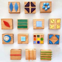 wooden blocks with different shapes and colors on them