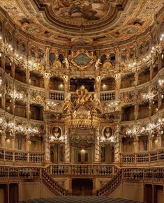 an ornately decorated auditorium with chandeliers