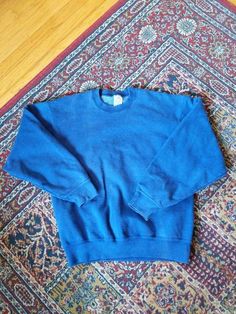 "Vintage Munsingwear Super Cotton Blue Sweatshirt, size medium. In very good used condition! MEASUREMENTS ----------------------- Length: 25.5\" Shoulders: 20.5\" Pits: 21.5\" Shoulder to wrist: 21.25\"" Oversized Blue 90s Sweatshirt, Blue 90s Style Sweatshirt For Fall, Oversized Blue Vintage Sweater, 90s Blue Tops, Vintage Oversized Blue Sweatshirt, Vintage Winter Sweats With Relaxed Fit, Vintage Relaxed Fit Winter Sweats, Oversized Blue Vintage Sweatshirt, Vintage Relaxed Fit Sweats For Winter