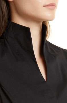 Hidden closures trace the front of a tailored, sleeveless blouse designed with a fashionable stand collar and split neck. Stand collar Split neck Sleeveless 71% cotton, 26% nylon, 3% spandex Hand wash, line dry Imported Split Neck Blouse, Chic Workwear Tops With Band Neckline, Split Neck Placket Top For Work, Split Neck Workwear Top With Placket, Chic Tops With Band Neckline For Workwear, Chic Band Neckline Tops For Work, Elegant Band Neckline Tops For Workwear, Workwear Blouse With Split Neck And Placket, Chic Fitted Top With Stand Collar