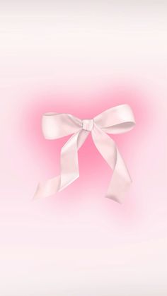 a white bow on a pink background