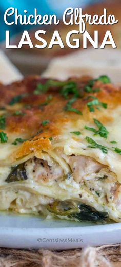 chicken alfredo lasagna on a white plate with parsley in the middle and text overlay