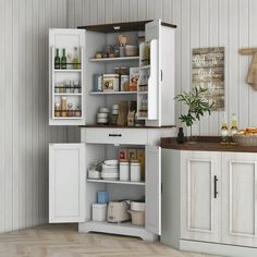 an open cabinet in the corner of a kitchen