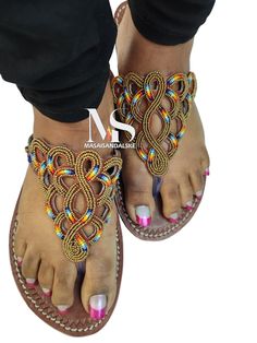 100% handmade using leather and fine beads. Masai beaded sandals are made using the pure original leather and quality African beads.They are inspired by the Masai community They are perfect for any occasion. True to size. We ship worldwide. Feel free to send me a convo for any clarifications Beaded Slippers, Beaded Leather Sandals, Beaded Shoes, Leather Sandals Handmade, Beaded Sandals, Shoes Photo, Slippers Shoes, Maasai, Sandals Slippers