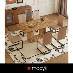 a dining room table with chairs and a rug