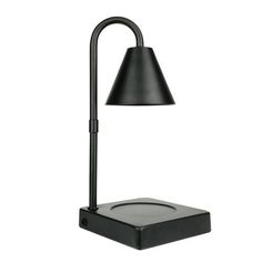 a black desk lamp on a white background with the light turned off to show its dim lighting