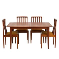 a wooden table with four chairs and one chair on the other side, against a white background