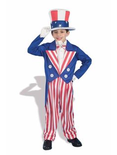 a young boy dressed in an american flag suit and top hat, standing with his hands on his head