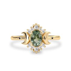 “If I were the moon, I would want you to be my sky.”This romantic piece... Alternative Ring, Green Sapphire Engagement, Green Sapphire Engagement Ring, Green Sapphire Ring, Future Engagement Rings, Ring Halo, Halo Design, Jewelry Appraisal, Moon Ring