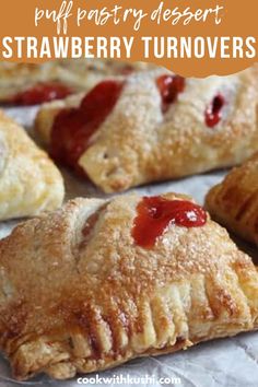 strawberry turnovers with text overlay that reads puff pastry dessert strawberry turnovers on parchment paper