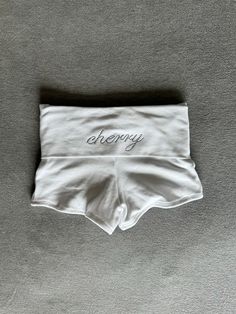 the cutest cherry branded foldover shorts <3 can adjust for high or low rise made sustainably with deadstock fabric model is wearing a size small Foldover Shorts, Micro Shorts, Deadstock Fabric, White Cherries, Sock Gifts, One Piece Dress, Happy Monday, The Cutest, Low Rise