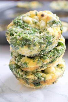 spinach and cheese muffins stacked on top of each other