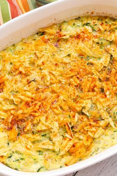 a casserole dish with zucchini and cheese