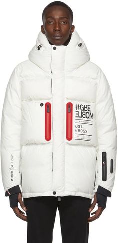 Moncler Grenoble.White Monteleger Down Jacket.Long sleeve down-filled nylon ripstop jacket in off-white. Logo text and graphics printed in black throughout. Padded trim featuring signature tricolor stripes at back..· Bungee-style drawstring at hood.· Concealed two-way zip closure with Velcro storm placket.· Zip pockets at chest and waist.· Earphone opening at chest.· Zip pocket and RECCO® rescue reflector at sleeve.· Inset gaiters with thumb holes at adjustable cuffs.· Bungee-style drawstring at Down Puffer Jacket, Logo Text, Activewear Fashion, Designer Clothes For Men, Mountaineering, White Casual, Outdoor Adventure, Casual Jacket, Jacket Style