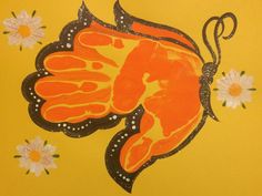 an orange and black painting with flowers on it