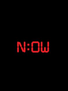 the word now written in red on a black background