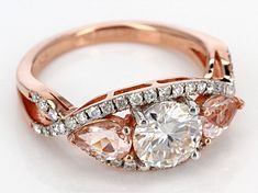 Pre-Owned Moissanite Fire™ 1.60ctw diamond equivalent weight round and .66ctw pear shape Morganite, 14K rose gold over sterling silver ring. Measures 5/16" L x 1/16" W and is not sizeable. Actual moissanite weight is 1.50ctw. Comes with certificate of authenticity..  This product may be a customer return, vendor sample, or on-air display and is not in its originally manufactured condition.  It may not be new.  In some instances, these items are repackaged by JTV. Morganite Diamond Ring With Diamond Accents, Gia Certified Morganite Jewelry For Anniversary, Morganite Brilliant Cut Diamond Ring, Morganite Diamond Ring With Center Stone In Round Cut, Morganite Diamond Ring With Center Stone, Round Cut, Morganite Round Cut Diamond Ring With Center Stone, Gia Certified Rose Gold Round Cut Diamond Ring, Morganite Diamond Ring With Prong Setting, Jewelry Television