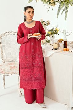 Presenting "Rosewood," a timeless addition to our collection. This deep pink ensemble boasts subtle yet sophisticated tone-on-tone chikankari embroidery, exuding understated grace. Paired with sleek straight trouser pants, it effortlessly transitions from daily wear to office chic, embodying comfort and class with every stitch. Elevate your wardrobe with the enduring charm of "Rosewood," where style meets versatility in perfect harmony. Elegant Red Palazzo Set With Chikankari Embroidery, Elegant Red Unstitched Suit With Floral Embroidery, Wedding Palazzo Set With Cutwork Straight Kurta, Elegant Cutwork Palazzo Set For Festive Occasions, Elegant Cutwork Palazzo Set For Eid, Festive Cutwork Palazzo Set, Elegant Cutwork Salwar Kameez For Festive Occasions, Festive Wedding Palazzo Set With Cutwork, Festive Lawn Suit With Cutwork